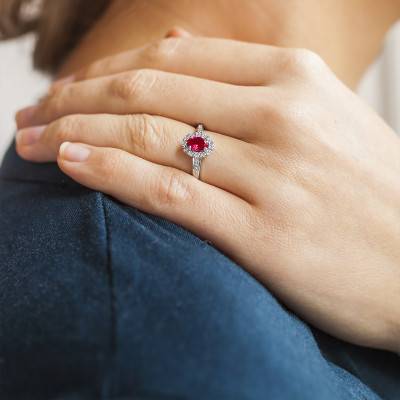 Joelli Daisy Ring in 750/1000 White Gold with Ruby 0.62 ct and Diamond Halo 0.11 ct - Joelli