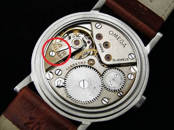 Raquette de réglage d'une montre Omega vintage (Source : Forum A Montres)